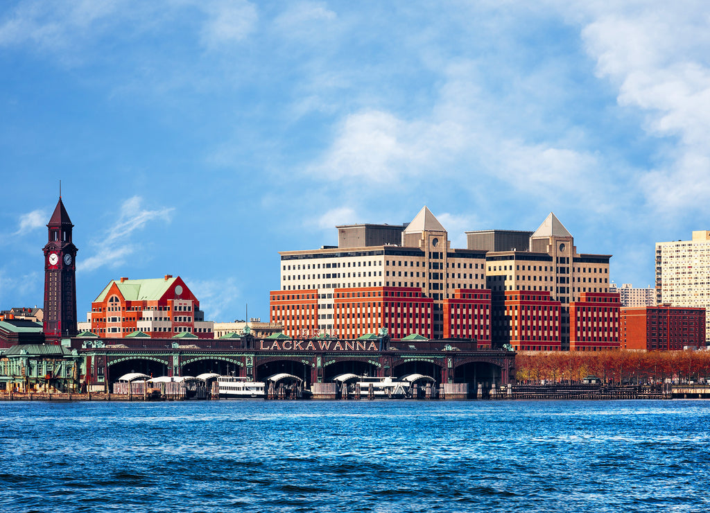 Hoboken, New Jersey waterfront and skyline viewed from the Hudson River. The historic Lackawanna train terminal, built 1907, is seen in the foreground