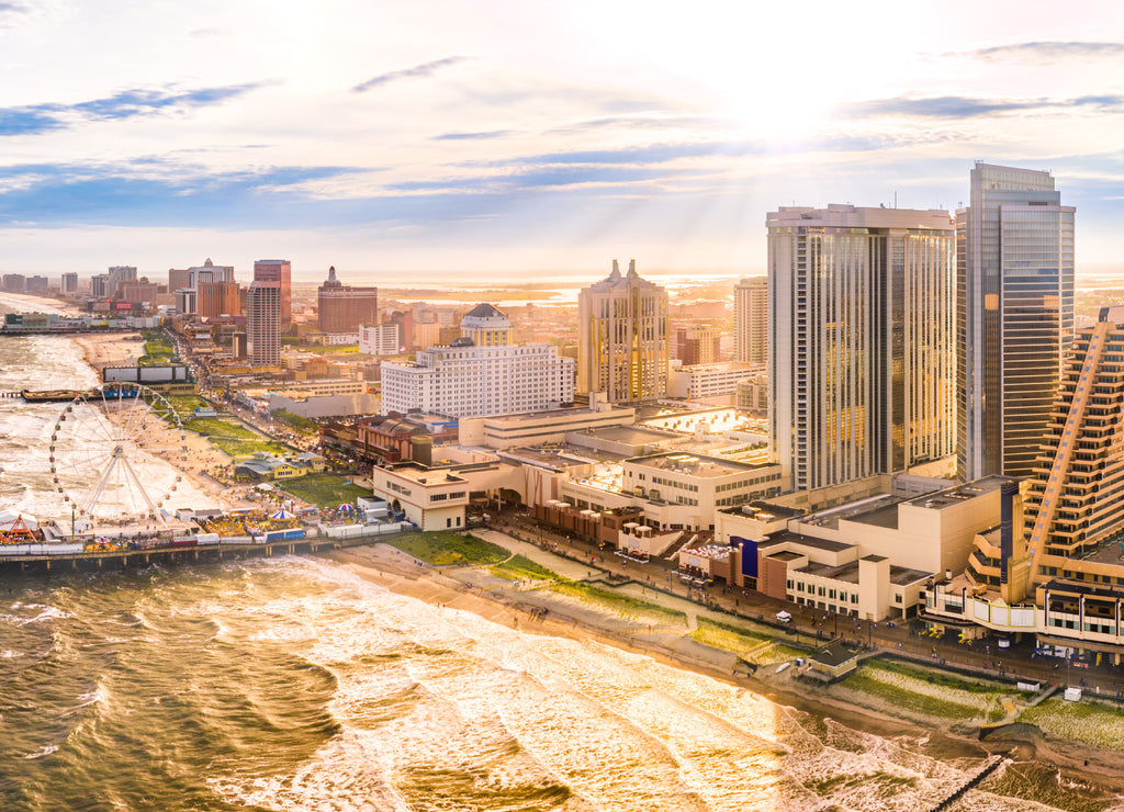 Late afternoon aerial panorama of Atlantic city along the boardwalk. Atlantic City achieved nationwide attention as a gambling resort and currently has nine large casinos, New Jersey