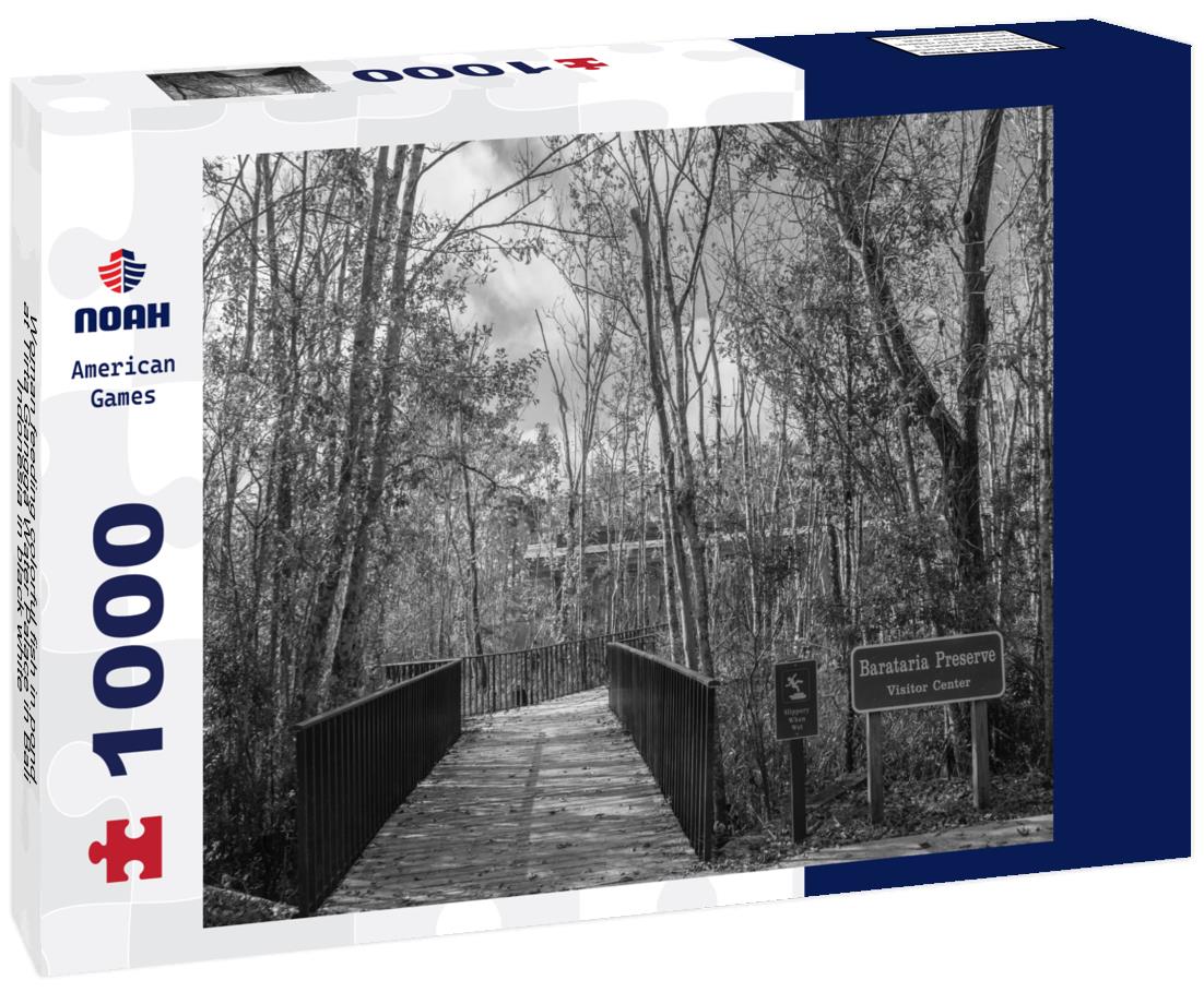 Noah Jigsaw Puzzle Woman feeding colorful fish in pond at Tirta Gangga Water Palace in Bali, Indonesia in black white 1000 pieces