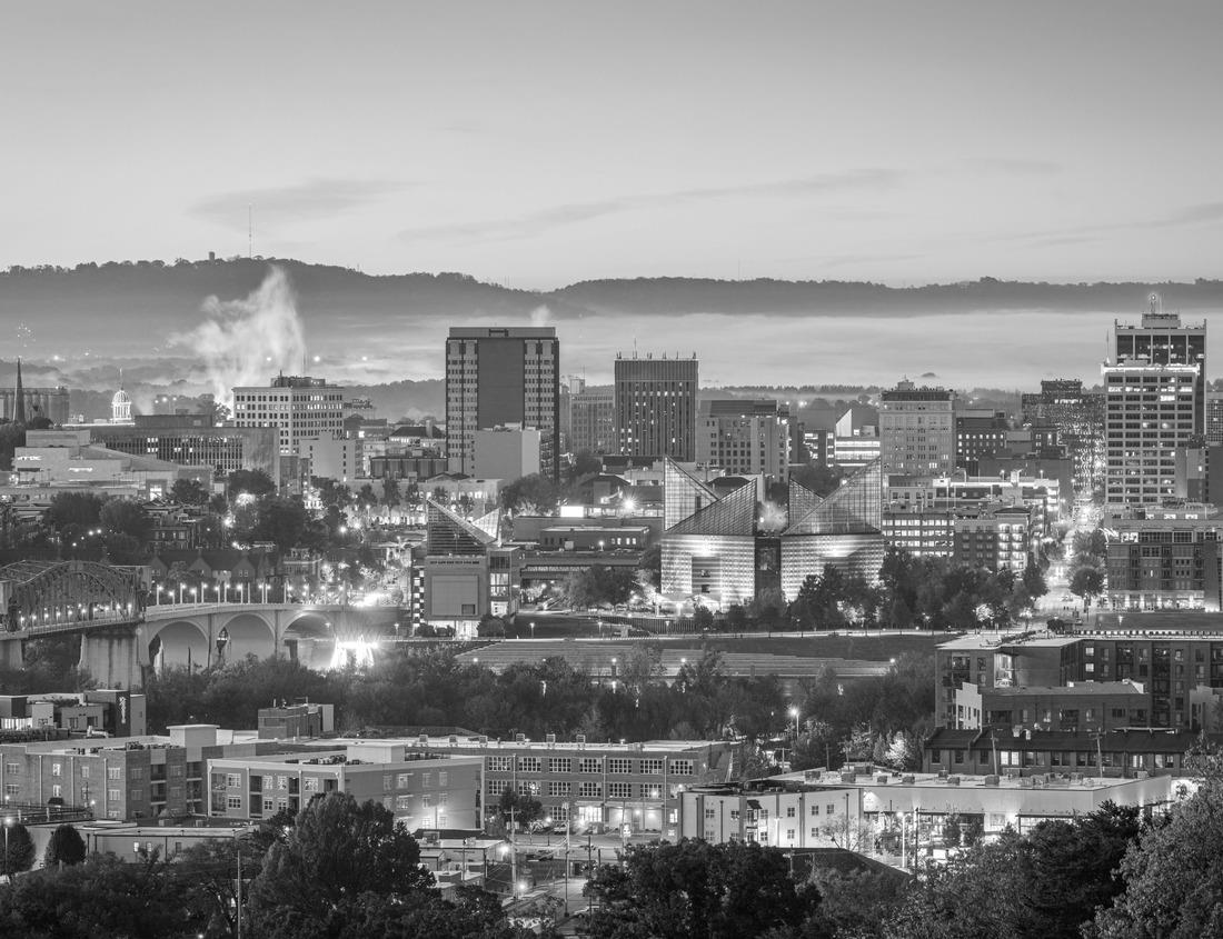 Noah Jigsaw Puzzle Aerial view of well-preserved medieval buildings hilltop, 10th-century Guimarães Castle with stunning sunset orange sky in black white 1000 pieces