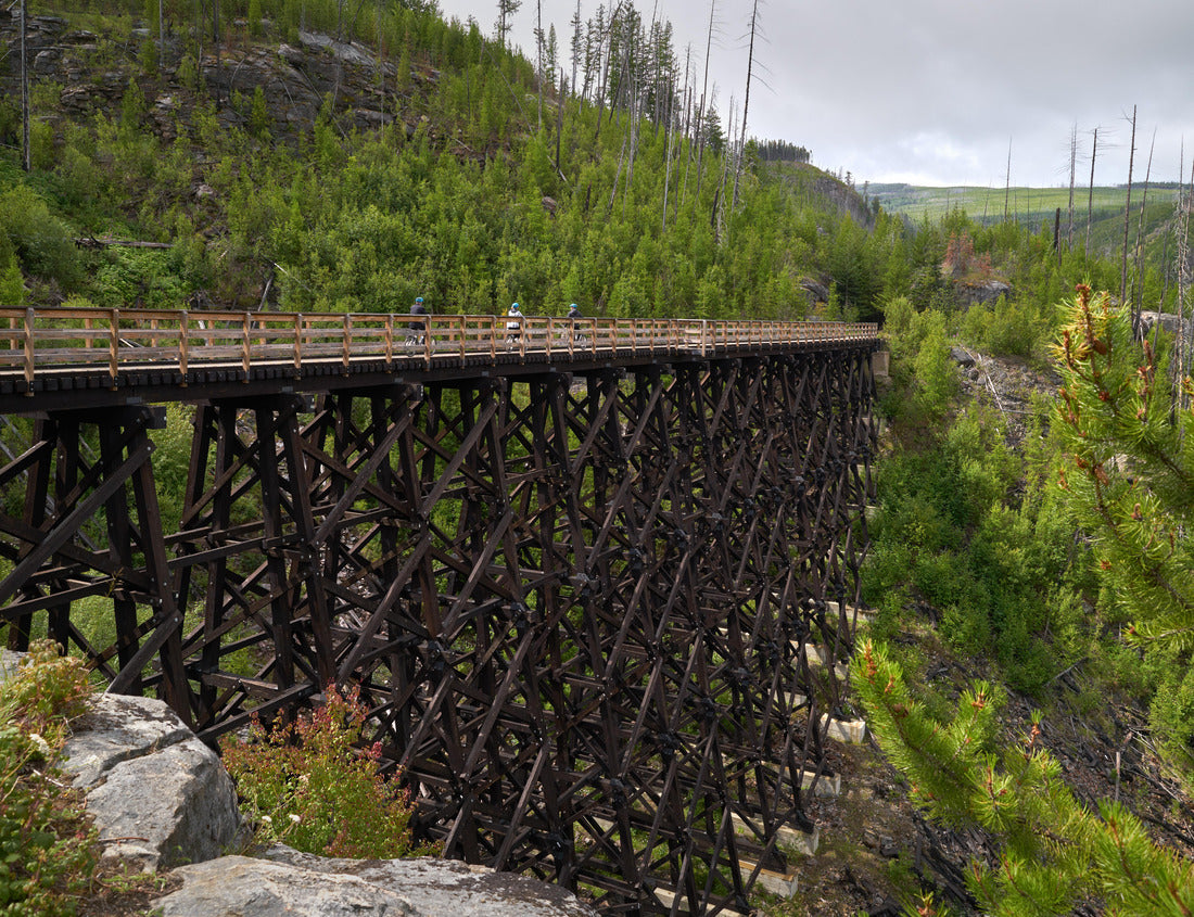 Noah Jigsaw Puzzle Myra Canyon Trestle Trail Kelowna. Cyclists cross one of the trestles in Myra-Bellevue Provincial Park in Kelowna 1000 pieces