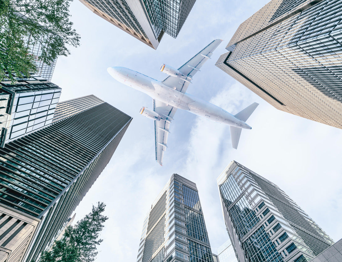 Noah Jigsaw Puzzle Aircraft flying above glass office buildings in the sky over city buildings in financial district of Tokyo city, Japan 1000 pieces