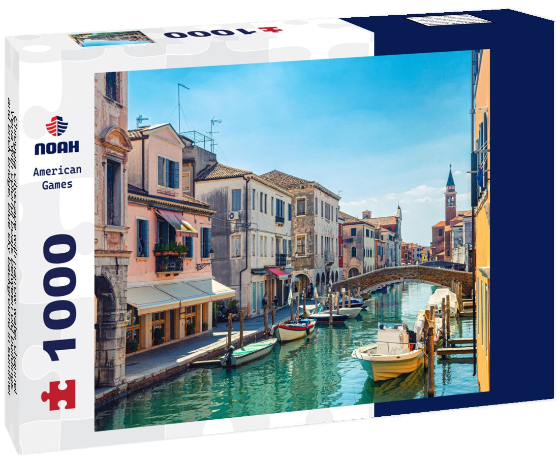 Noah Jigsaw Puzzle Chioggia cityscape with narrow water channel Vena with colorful boats between old buildings and brick bridge, blue sky background in summer, Veneto region, northern Italy 1000 pieces