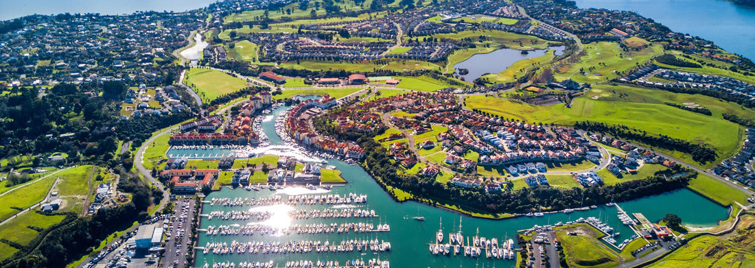 Noah Jigsaw Puzzle Aerial view of residential suburbs surrounded by a sunny ocean harbor. Whangaparoa Peninsula, Auckland, New Zealand Panorama 1000 Pieces