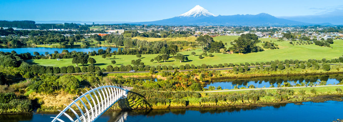Noah Jigsaw Puzzle Aerial view of a beautiful bridge over a small river with Mount Taranaki in the background. New Zealand Panorama 1000 Pieces