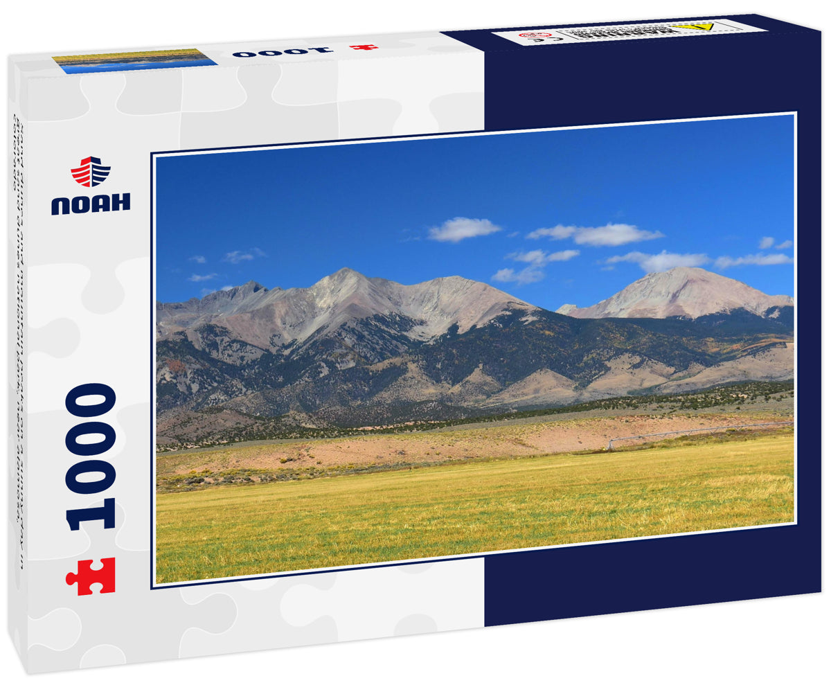 Sand dunes and mountain peaks on a sunny day in great sand dunes national park, near alamosa, colorado