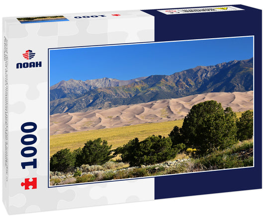Sand dunes and mountain peaks on a sunny day in great sand dunes national park, near alamosa, colorado