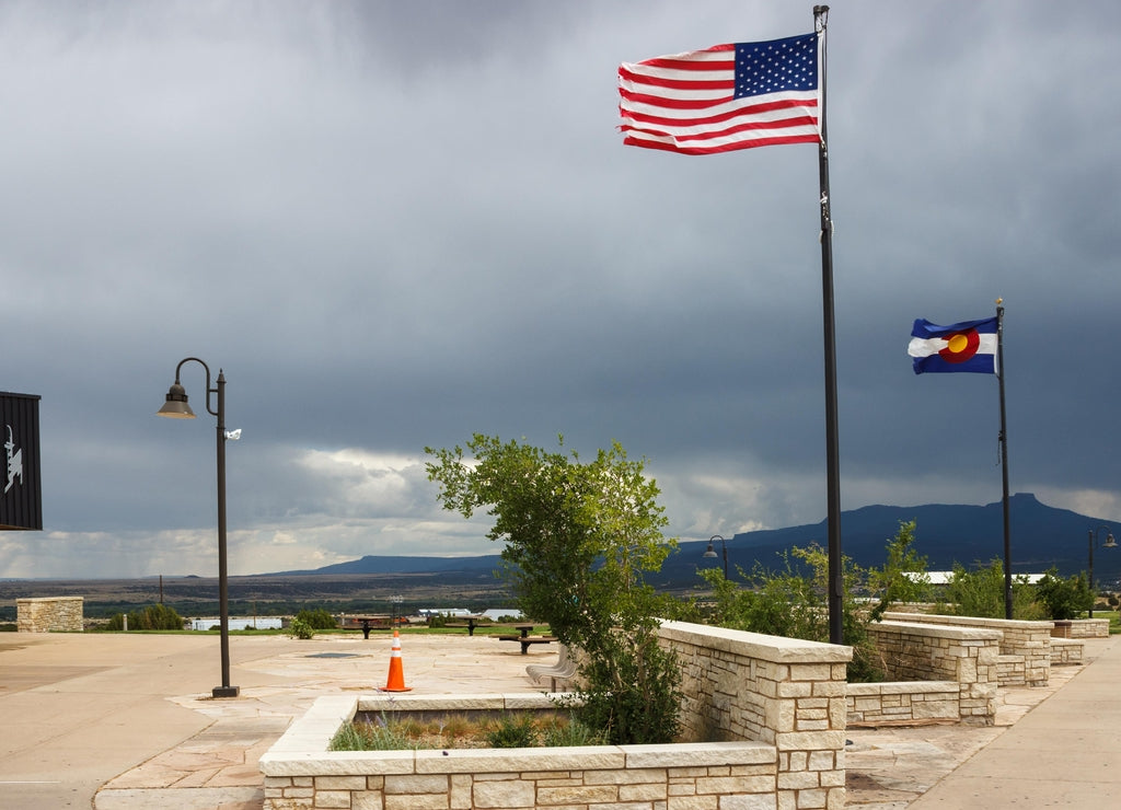 Recreation area on the Santa Fe Trail. Flags of the USA and the state of Colorado are flying in the wind