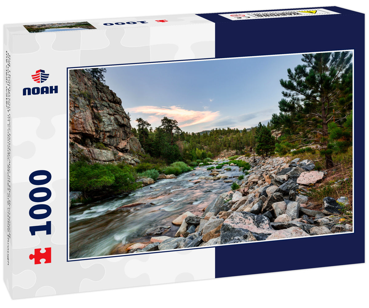 Big Thompson river landscape in the Roosevelt National Forest in Colorado. Stones are visible through the clear water