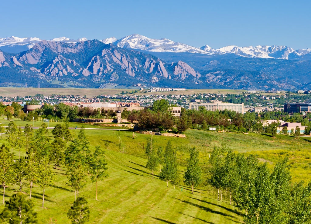 Interlocken Business Park with housing development in background, in Broomfield, looking toward Boulder, the flatirons, and the Indian Peaks, Broomfield County, Colorado