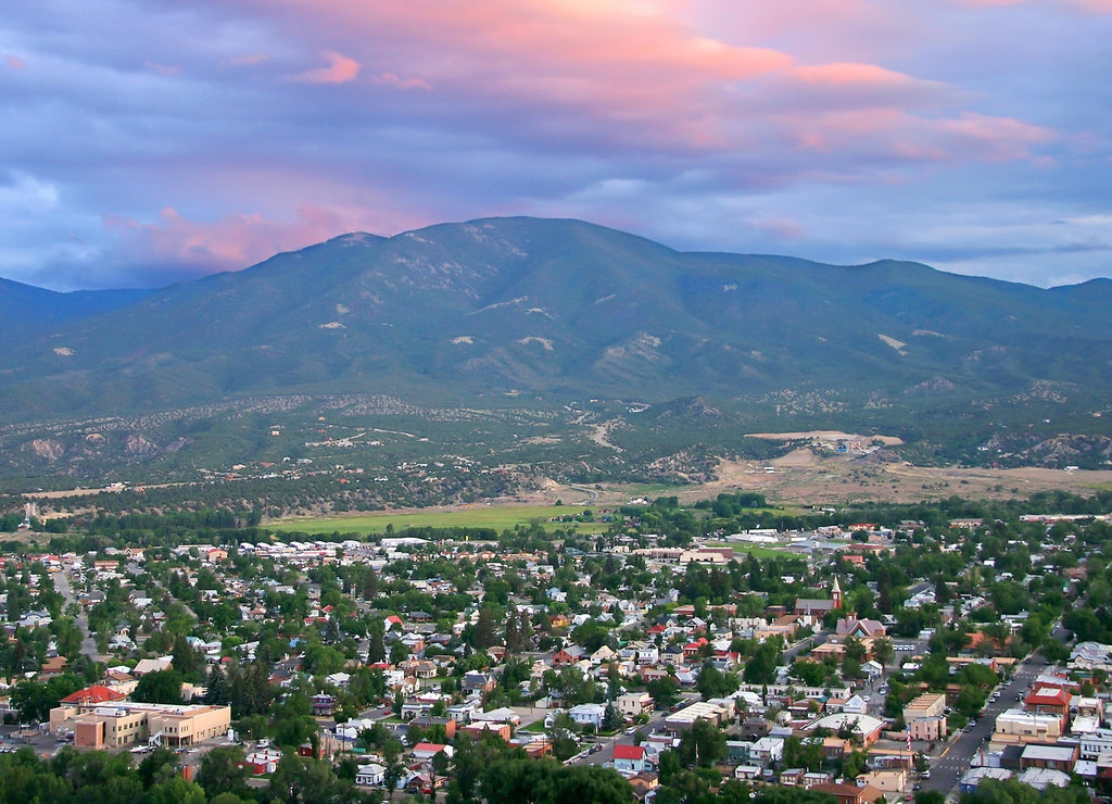 Salida Colorado Overlook - Aerial view of Salida Colorado, with beautiful pink sunset cloud overhead and mountain range in background. Chaffee County