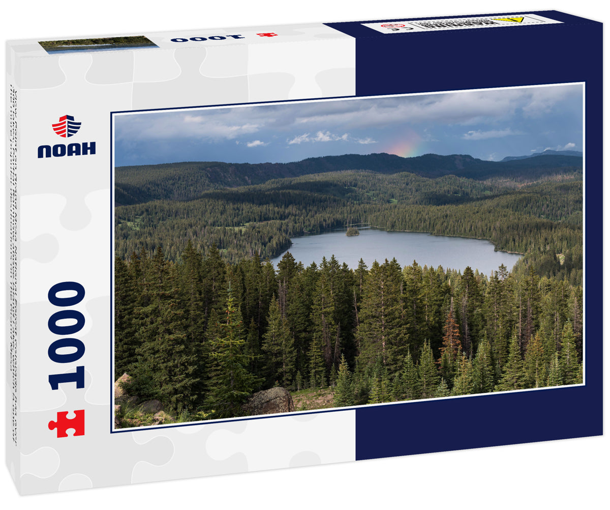 View Point on Grand Mesa National Forest Colorado has over 300 lakes. Partial Rainbow above Island Lake, which is one of the more popular destinations on the Grand Mesa