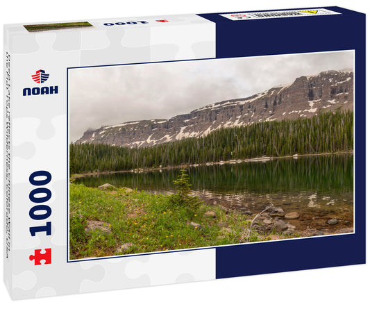 Deep Lake reflects the Chinese Wall in the Flat Tops Wilderness, Colorado, USA