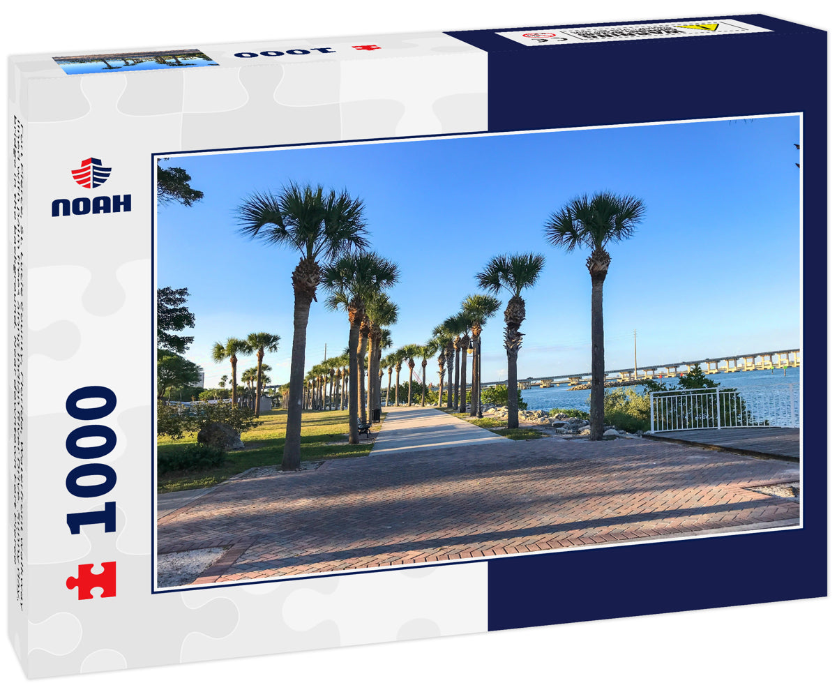 Fort Pierce, St. Lucie County, Florida, Waterfront walkway lined with palm trees along Indian River Drive. Sunny day, bridge in the background. Near downtown Fort Pierce