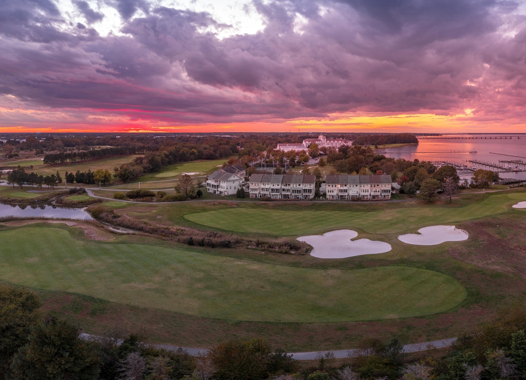 sunset view of a resort with a golf course near the Chesapeake in Cambridge Maryland with dramatic sky