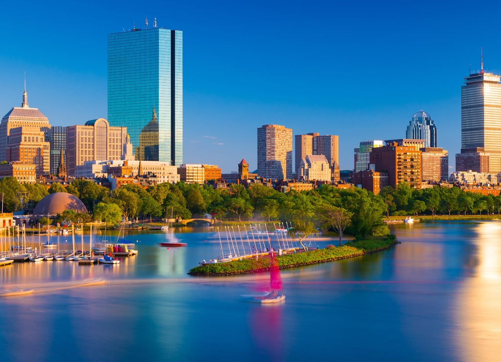 Boston skyline at the evening. Cityscape of Back Bay Boston. Skyscrapers and office buildings reflected in the water of Charles River