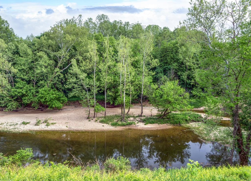 The Muscatatuck River flows through a park with beautiful woods near North Vernon in Jennings County, Indiana