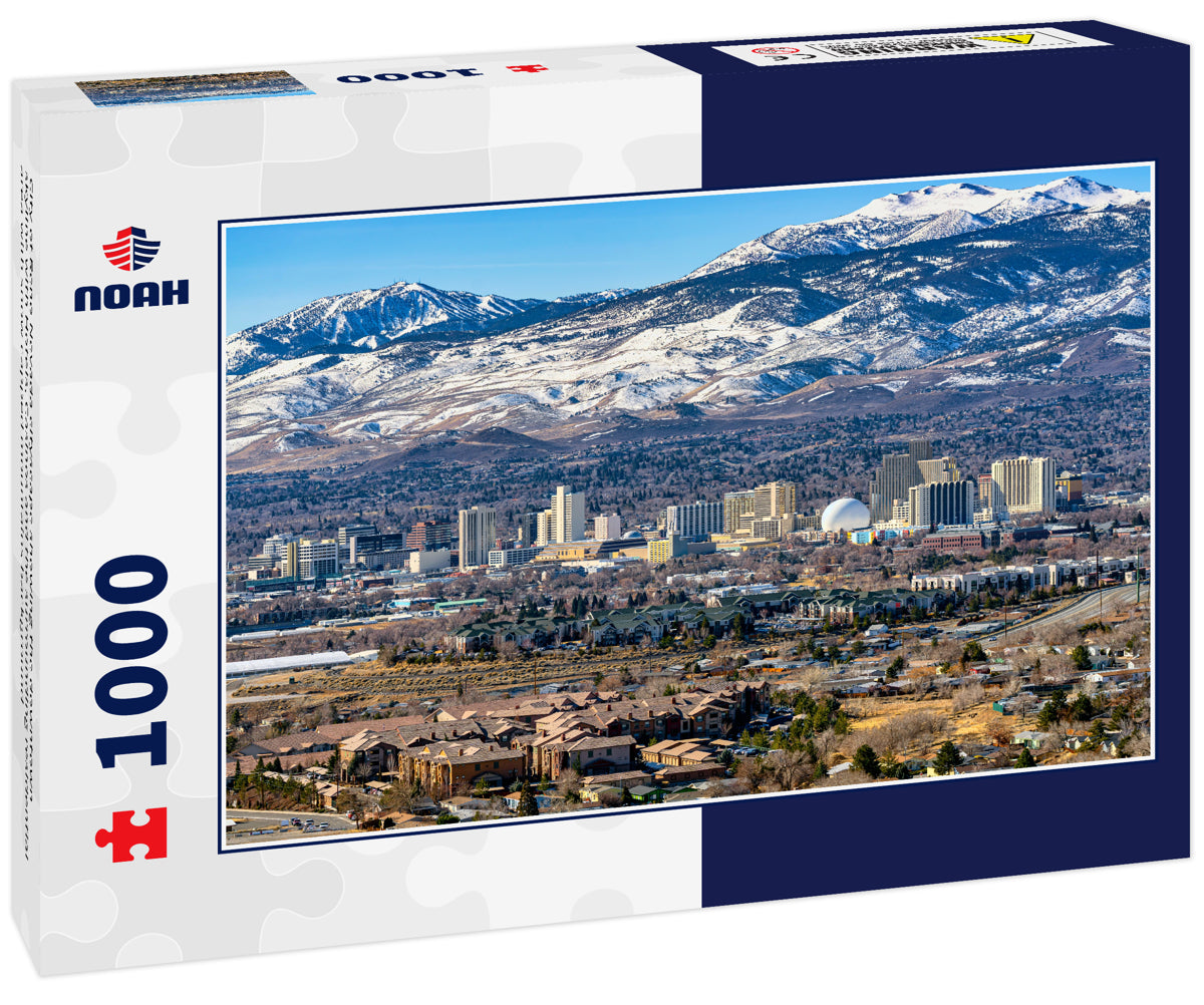 City of Reno Nevada cityscape showing the downtown skyline with Hotels, Casinos and the surrounding residential area with snow capped mountains background