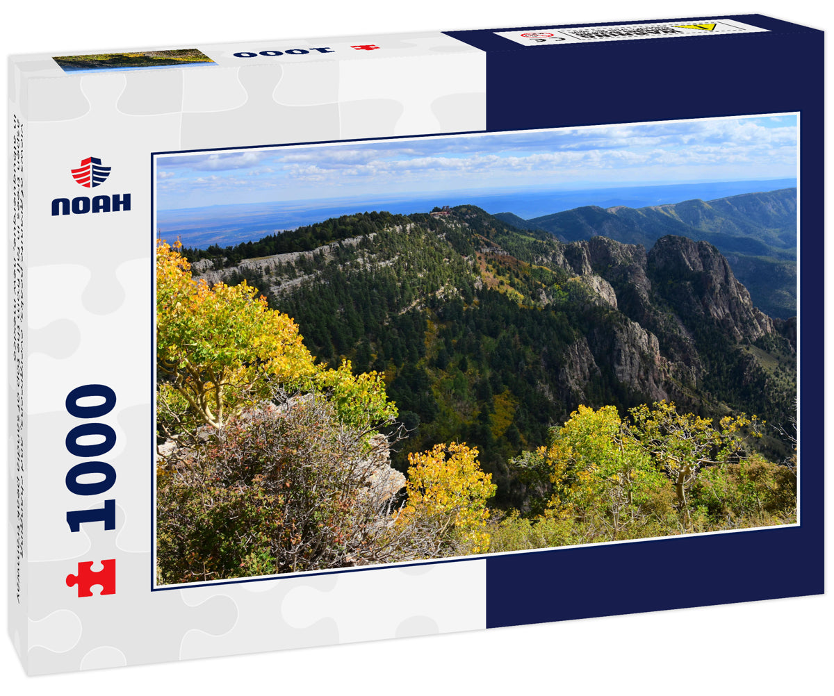 views of granite peaks, evergreens, and changing aspen trees in fall from the top of sandia peak tramway in albuquerque, new mexico