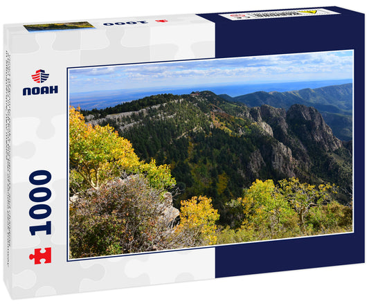 views of granite peaks, evergreens, and changing aspen trees in fall from the top of sandia peak tramway in albuquerque, new mexico