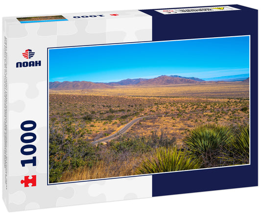 Organ Mountains, Desert Peaks National Monument in Las Cruces, Doña Ana County, New Mexico, Southwestern USA, tranquil arid desert land and plains with curved paved road and Yucca wilderness plants