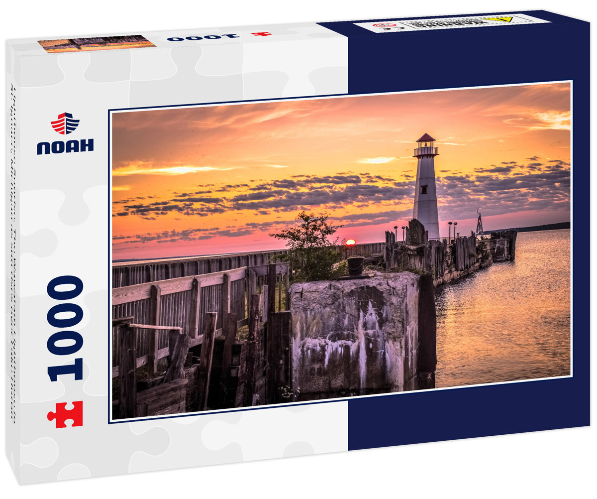 Lighthouse Sunrise. The Wawatam Lighthouse in St. Ignace, Michigan as sun rises over Lake Huron