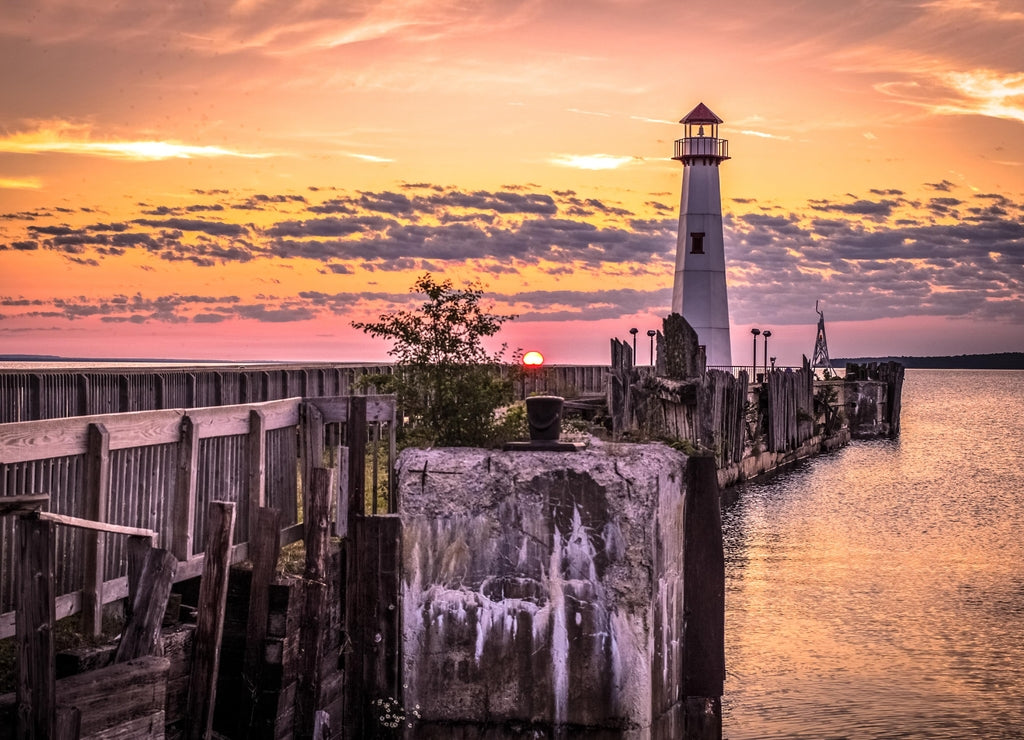 Lighthouse Sunrise. The Wawatam Lighthouse in St. Ignace, Michigan as sun rises over Lake Huron