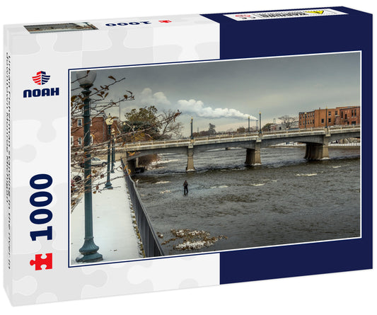 Urban Fisherman standing in the river in downtown Monroe Michigan