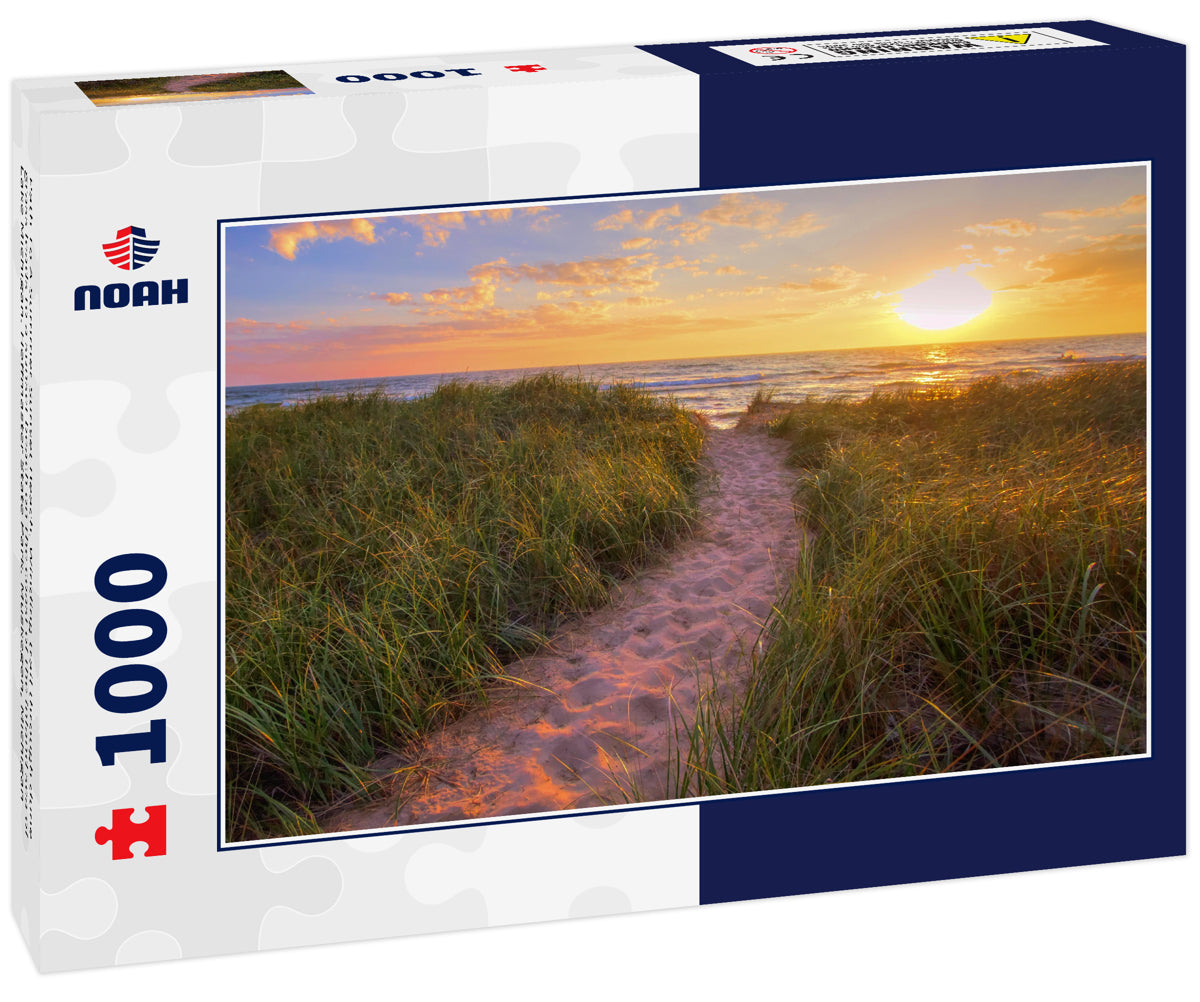 Path To A Summer Sunset Beach. Winding trail through dune grass leads to a sunset beach on the coast of the inland sea of Lake Michigan. Hoffmaster State Park. Muskegon, Michigan