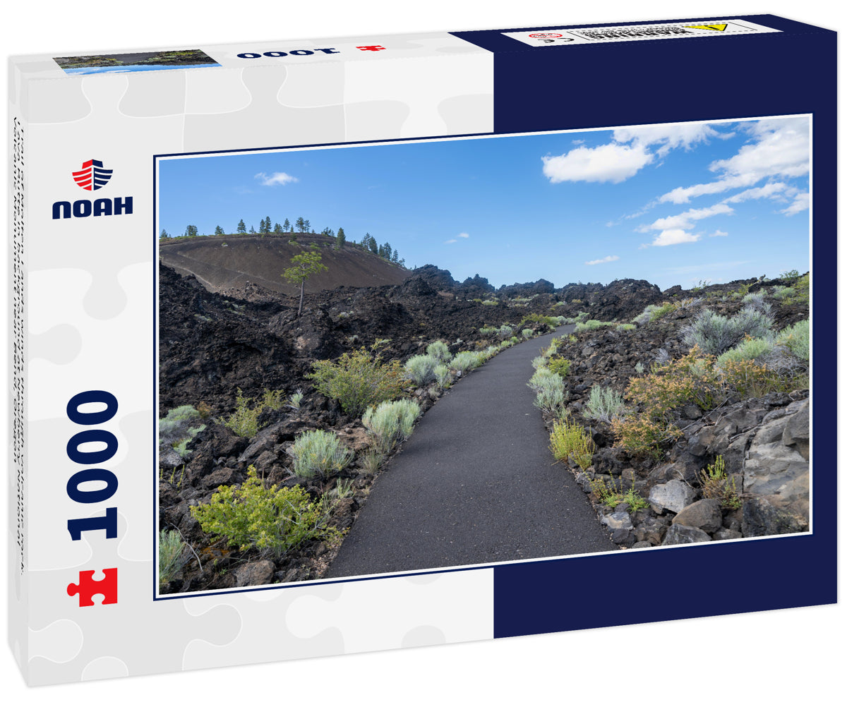 Trail of Molten Lands winds through volcanic rock. Lava Butte in background at Newberry National Volcanic Monument near Bend, Oregon