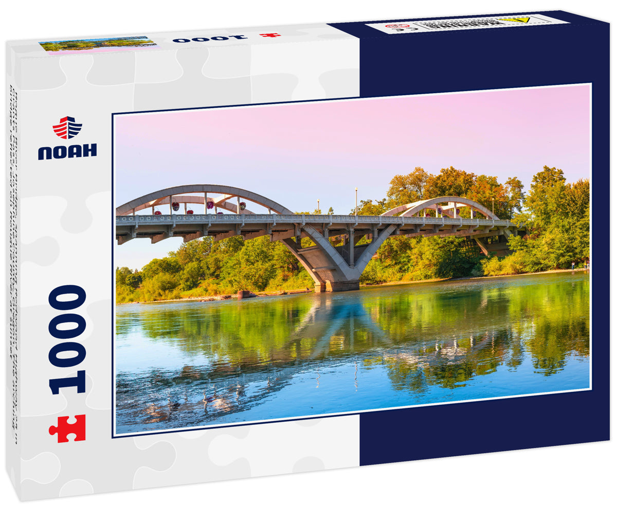 Rogue River Bridge, spanning Redwood Highway 25 in Grants Pass, Josephine County, Oregon. The arching bridge reflected on Rougue River at sunset