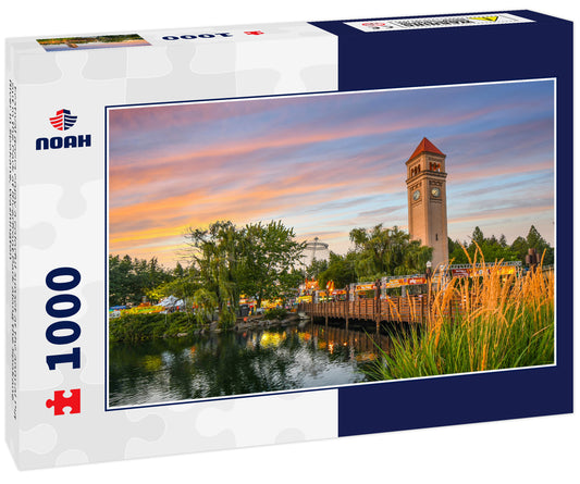 Festival goers enjoy a colorful sunset at the annual Pig out in the Park at Riverfront Park along the Spokane River in Spokane, Washington