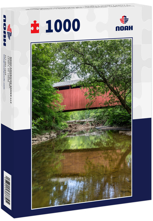 Built in 1891, the historic red Fletcher Covered Bridge crosses Tenmile Creek near Marshville in Harrison County, West Virginia