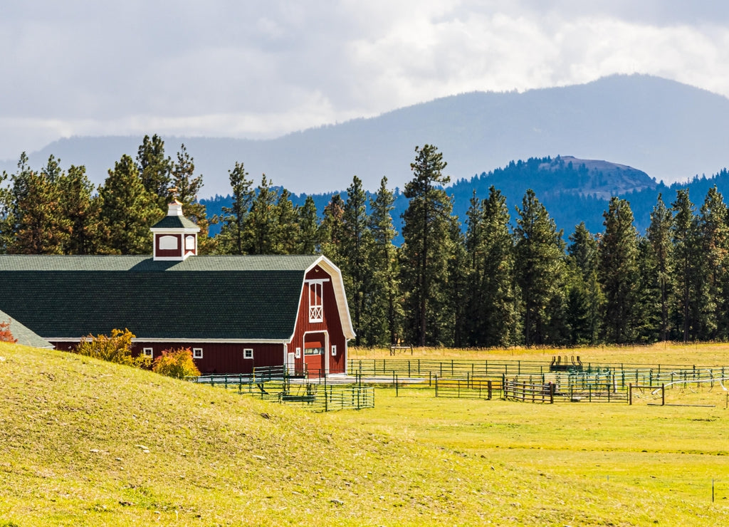 Red Barn With Mountains In The Distance, Lake County, Montana, USA