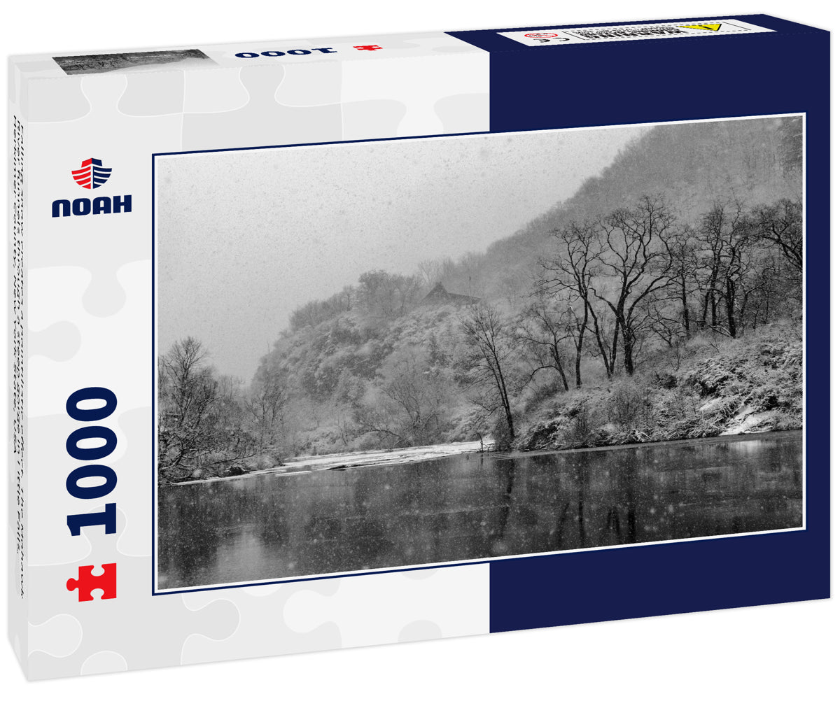 Falling snow creates a pointilistic effect. The Mohawk River funnels through a steep gorge in Little Falls, Herkimer County, New York State, USA