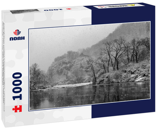 Falling snow creates a pointilistic effect. The Mohawk River funnels through a steep gorge in Little Falls, Herkimer County, New York State, USA