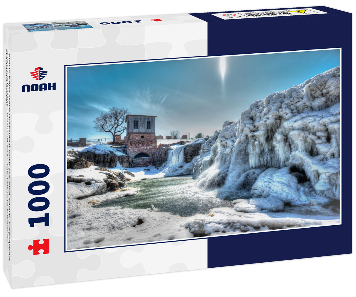 Sioux Falls Park waterfall with ice and snow. Cascading snowmelt water pouring over the top into a pool of standing water