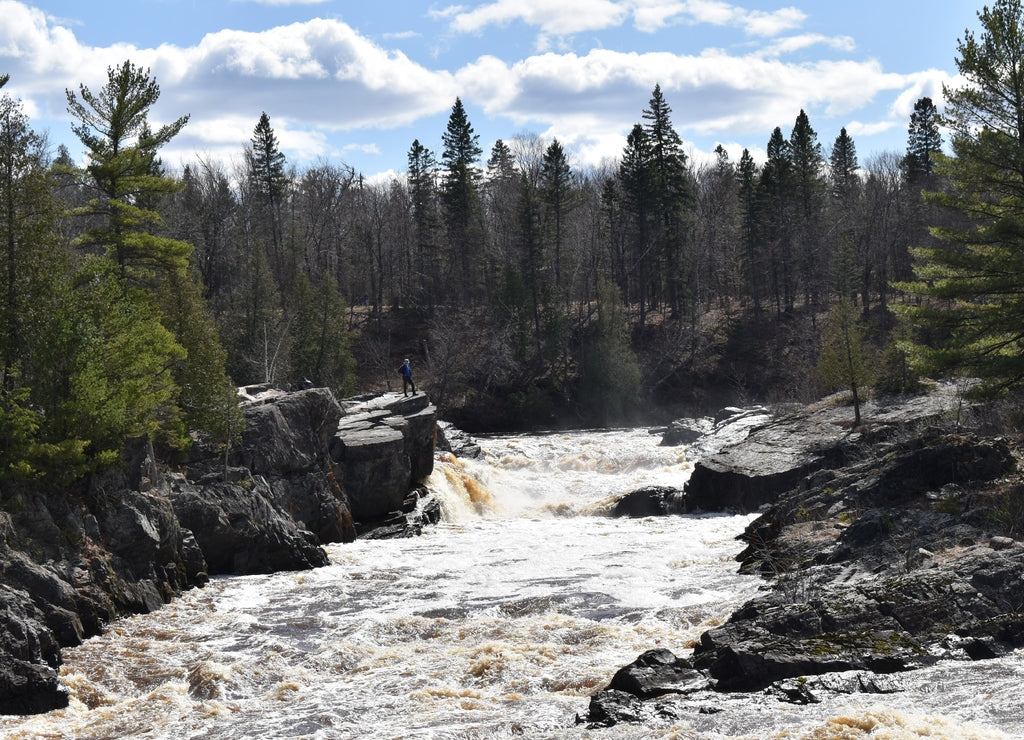 Jay Cooke State Park, Carlton - Handsome Man standing on Bluff above the churning water of the Saint Louis River