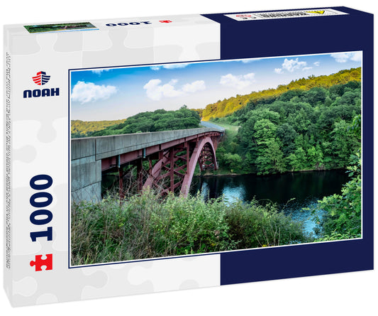 Bridge going over the Clarion River near Clarion, Pennsylvania, not far from the Allegheny National Forest. Green Trees, Bridge over the river and bright blue cloud filled sky in the background