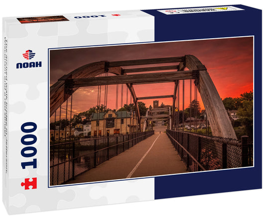 The arched walk bridge in Jefferson, Wisconsin and a red sunset