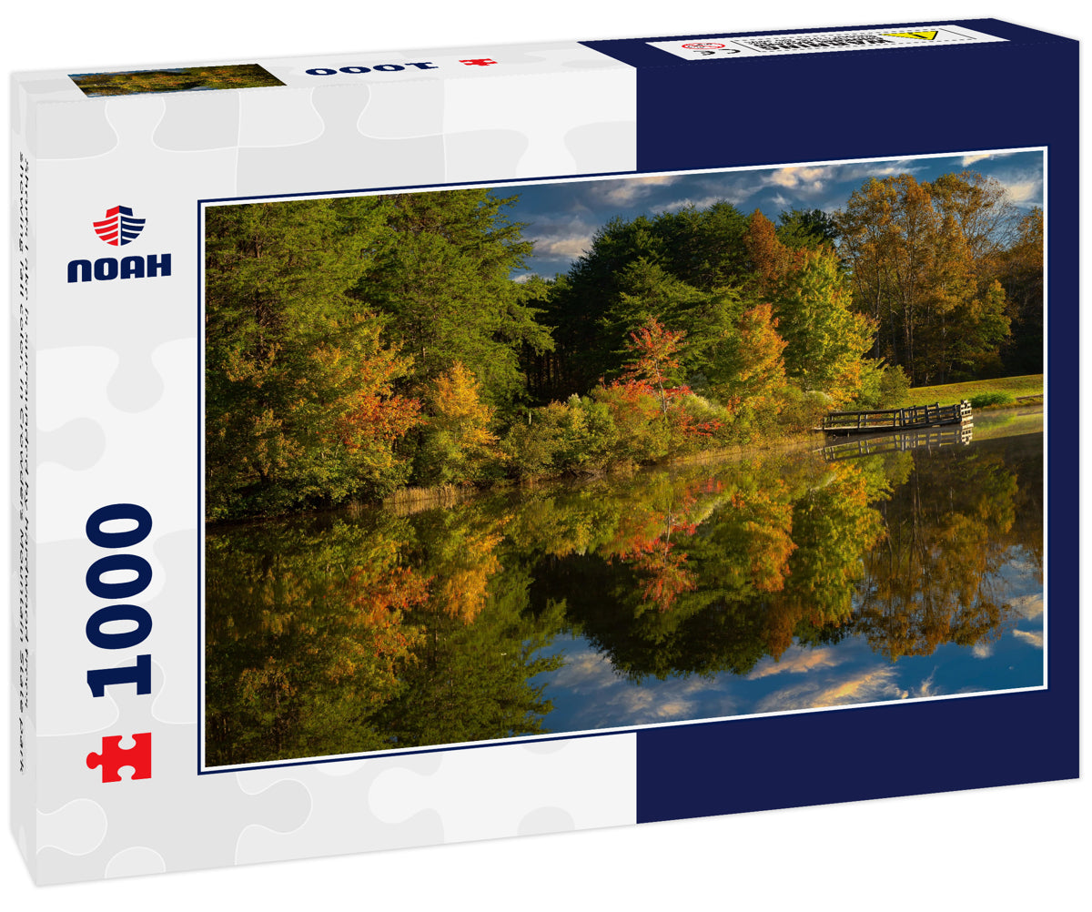 Shorts Lake is surrounded by hardwood trees showing fall color, in Crowders Mountain State park