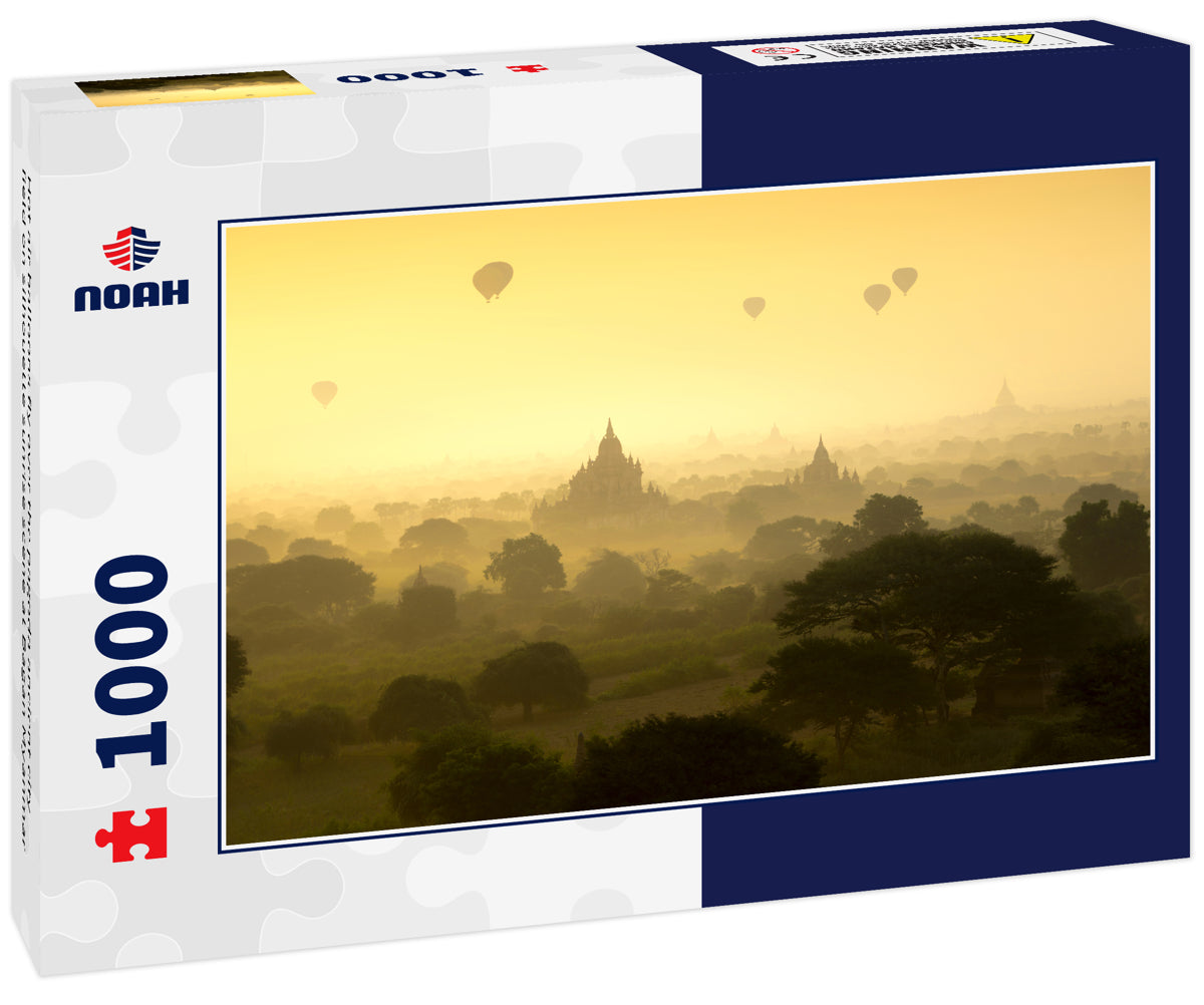 Hot air balloons fly over the pagoda ancient city field on silhouette sunrise scene at Bagan Myanmar
