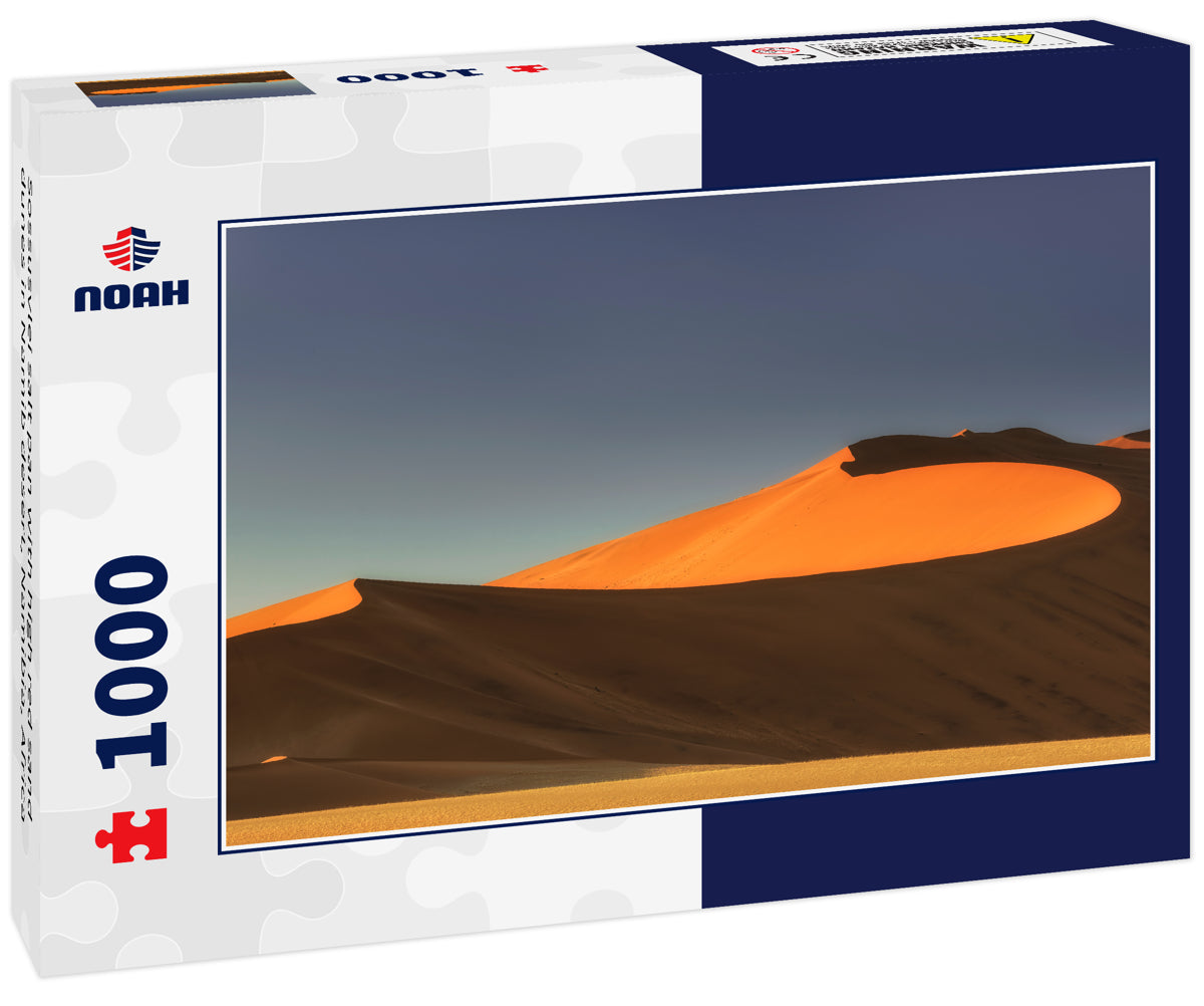 Sossusvlei salt pan with high red sand dunes in Namib desert, Namibia, Africa