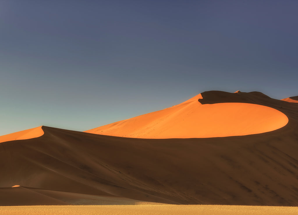 Sossusvlei salt pan with high red sand dunes in Namib desert, Namibia, Africa