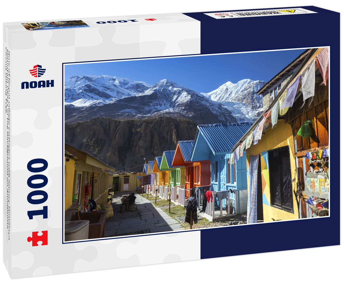 Row of Nepal Village Cottages with Snowy Himalaya Mountain Peaks in the Background on Annapurna Circuit Hiking Trek