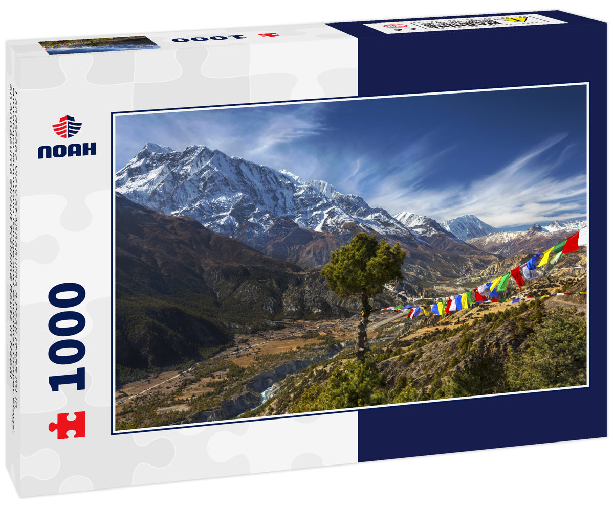 Landscape View of Annapurna 3 Peak (7555 m) in Himalaya Mountain Range and Buddhist Prayer Flags on Annapurna Circuit Trekking Route in Nepal