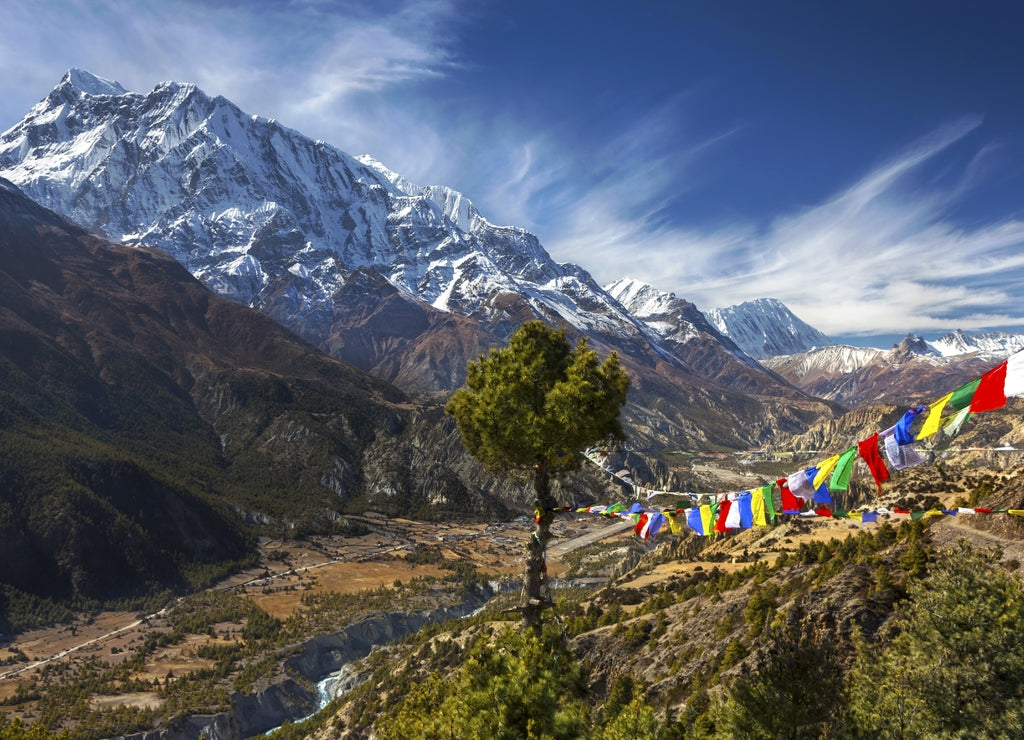 Landscape View of Annapurna 3 Peak (7555 m) in Himalaya Mountain Range and Buddhist Prayer Flags on Annapurna Circuit Trekking Route in Nepal