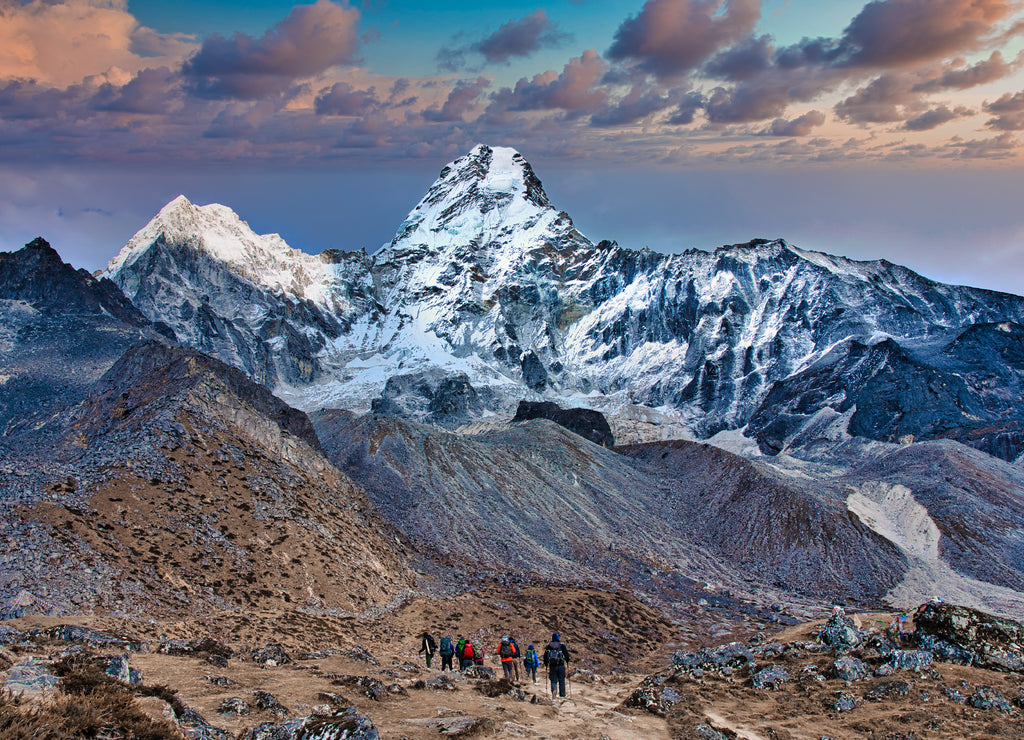 Awe inspiring peak of Ama Dablam - trekkers in the foreground, Himalayas, Nepal