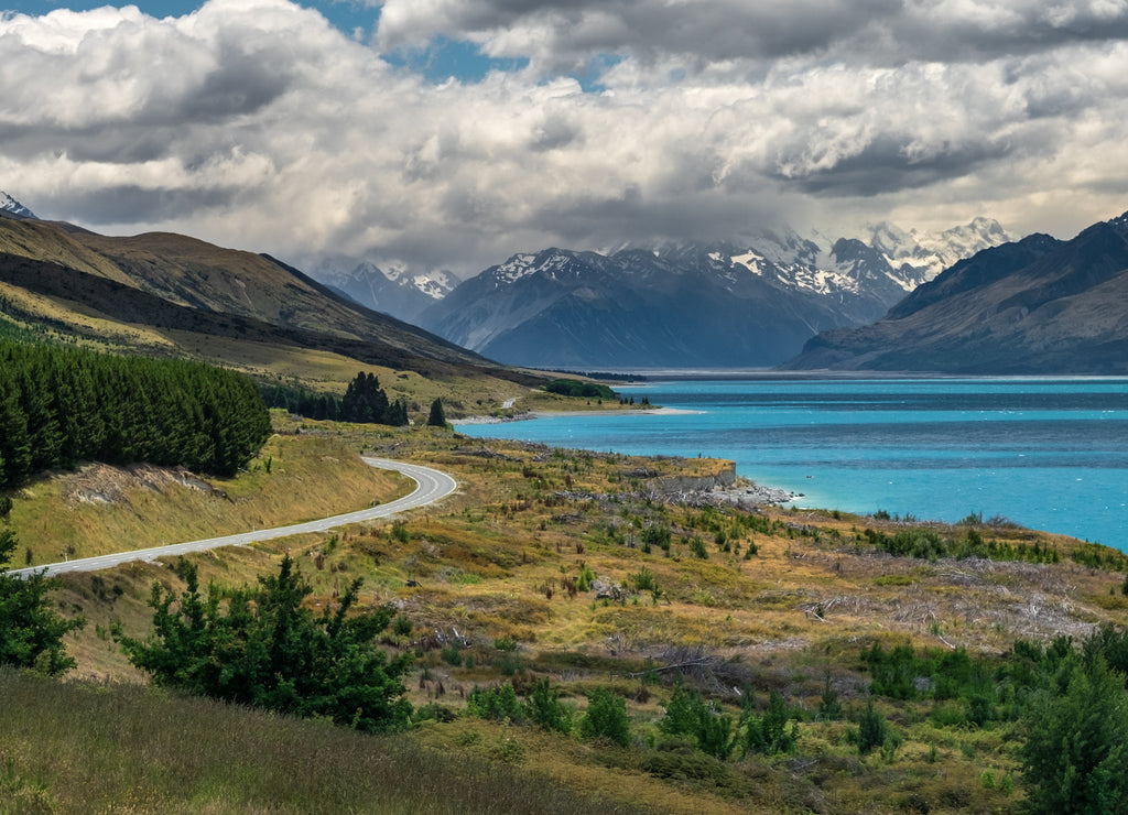 Winding road along beautiful Lake Pukaki in Mount Cook National Park