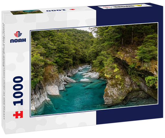 Colorful blue mountain river at the Haast pass, New Zealand